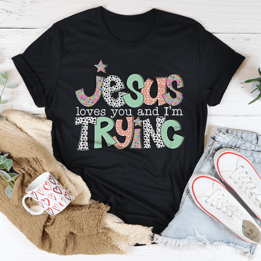 Jesus Loves You And I’m Trying Tee by MerchMallow